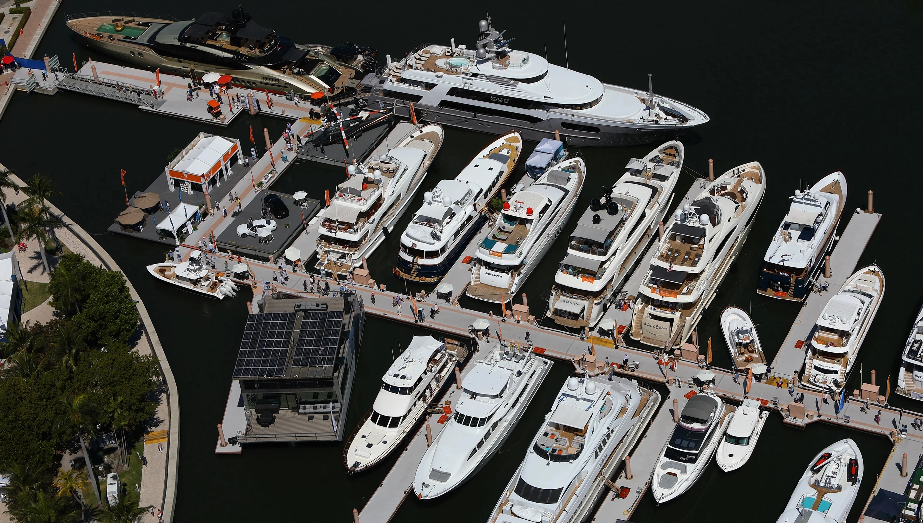 Large luxury superyachts docked at the expanded Palm Harbor Marina section of the Palm Beach International Boat Show.