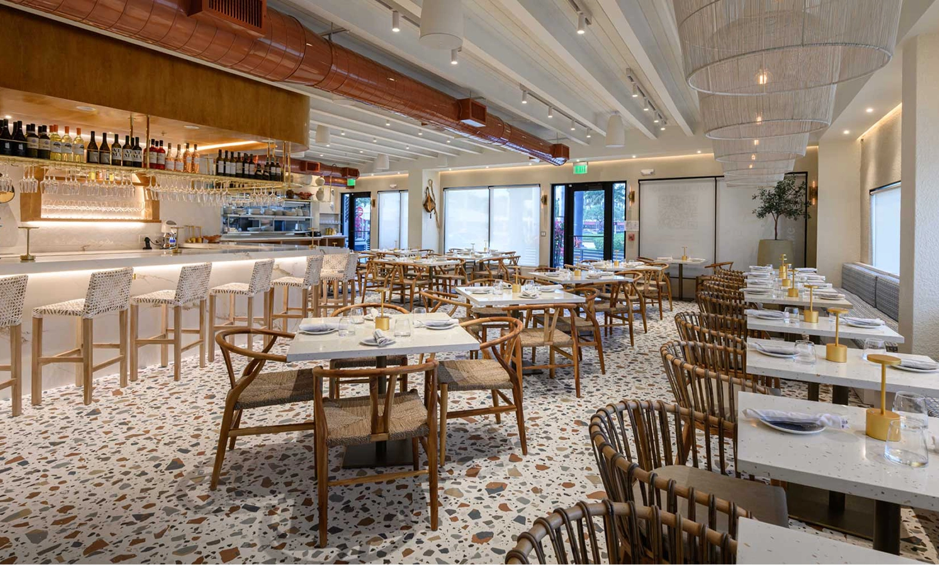 Theos Estiatorio Greek restaurant elegant interior designed by Hugo Mijares with Mediterranean cuisine display