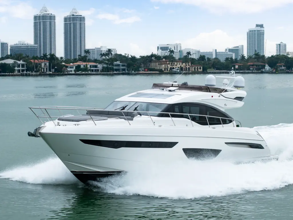 Princess flybridge motoryacht underway in Miami with city skyline
