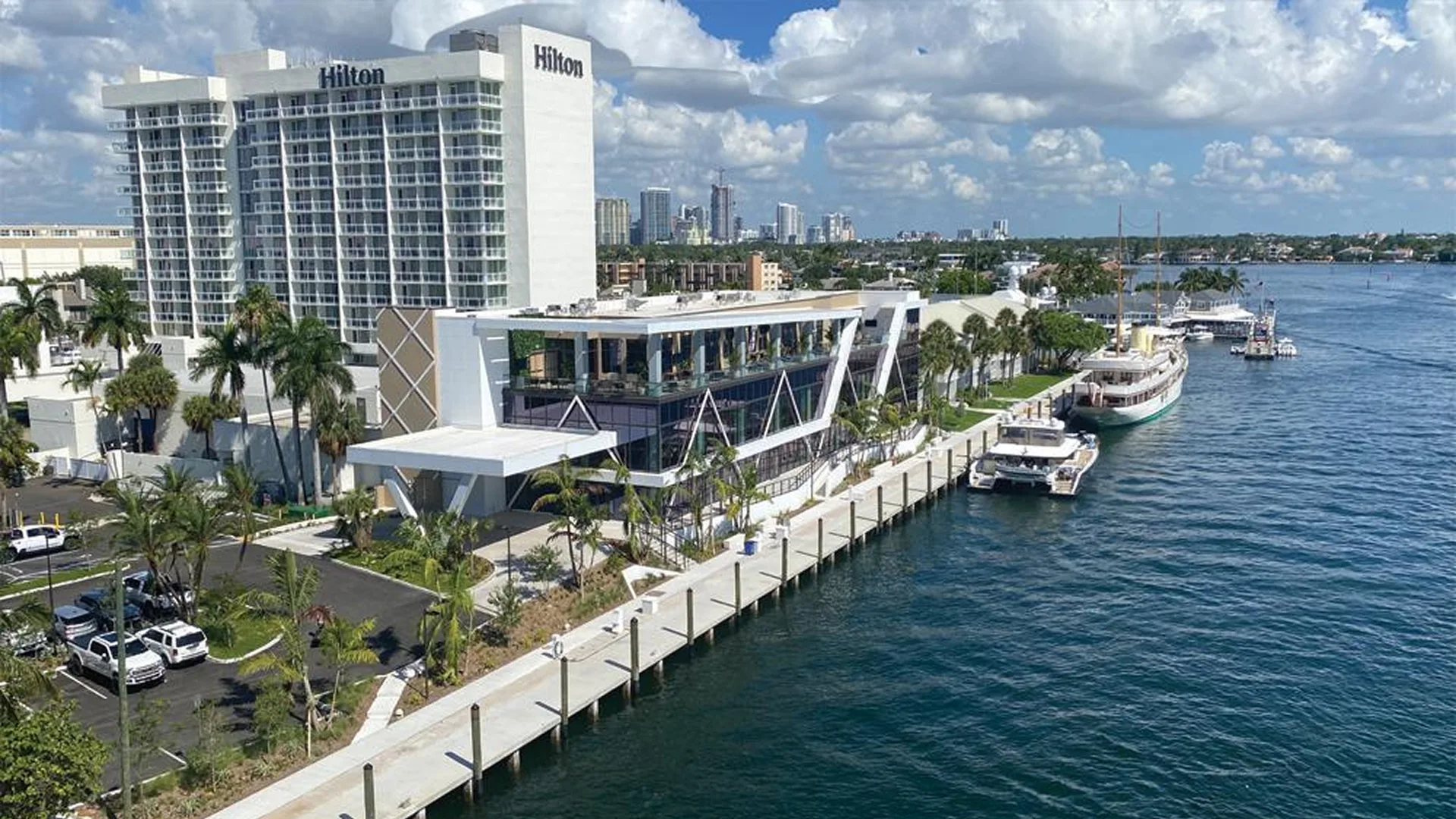 Aerial view of the Hilton Fort Lauderdale Marina and 17th Street Yacht Basin with yachts moored along the waterfront dock