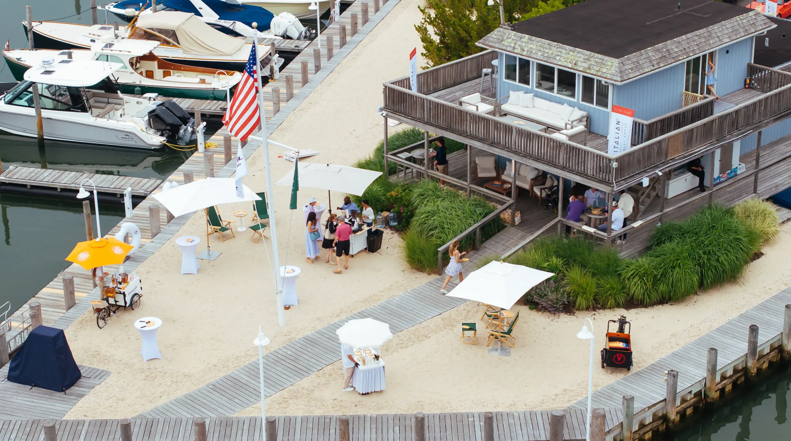 Guests enjoying Vanquish Yachts Hamptons showcase with spritzes and gelato