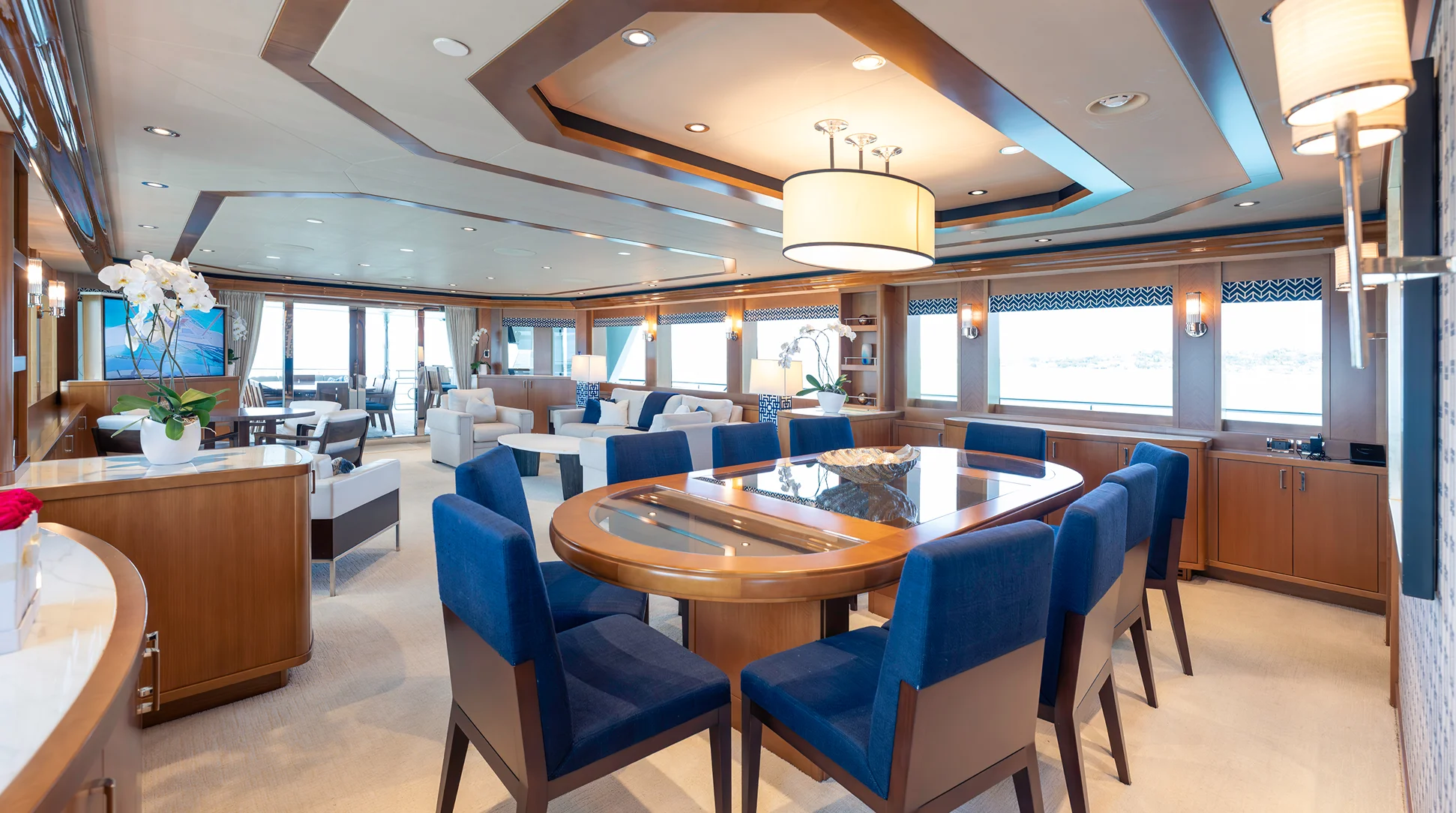 Westport 40M interior main salon with formal seating and pop-up TV — FAR NIENTE