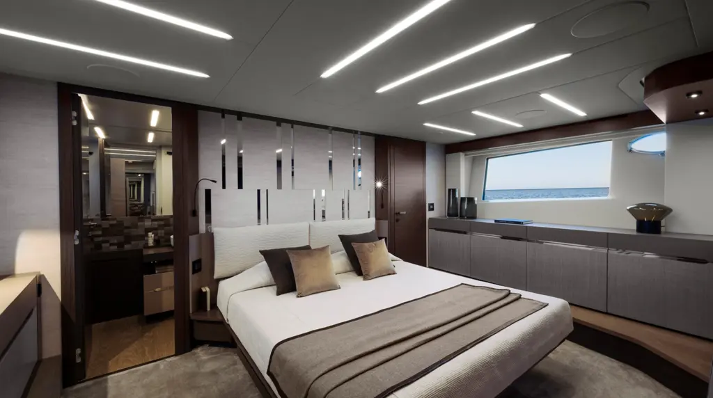 Full-beam owner's suite aboard the Pershing 8X with floor-to-ceiling windows and natural light